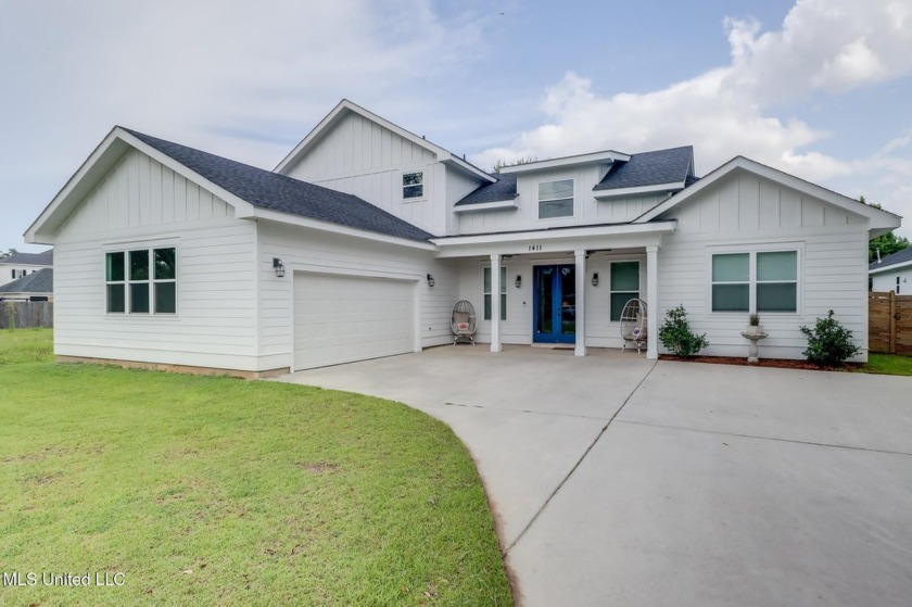 Located in the sought-after 2nd St community, this home sits - Beach Home for sale in Gulfport, Mississippi on Beachhouse.com