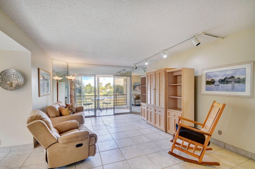 Discover your perfect retreat in this bright corner unit nestled - Beach Condo for sale in Lake Worth, Florida on Beachhouse.com