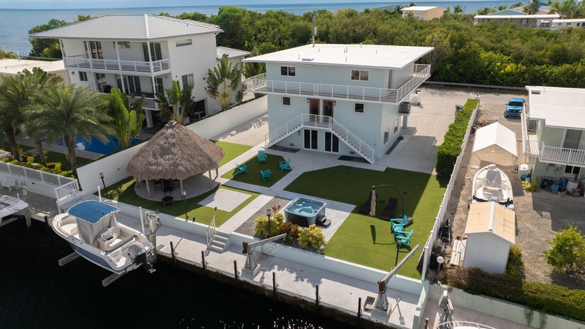 Discover this unique and versatile canal front property in Port - Beach Home for sale in Key Largo, Florida on Beachhouse.com