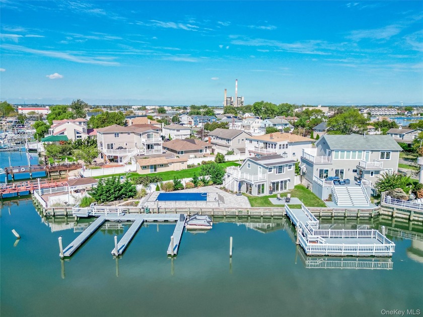 Welcome to this rare and extraordinary waterfront estate-the - Beach Home for sale in Island Park, New York on Beachhouse.com