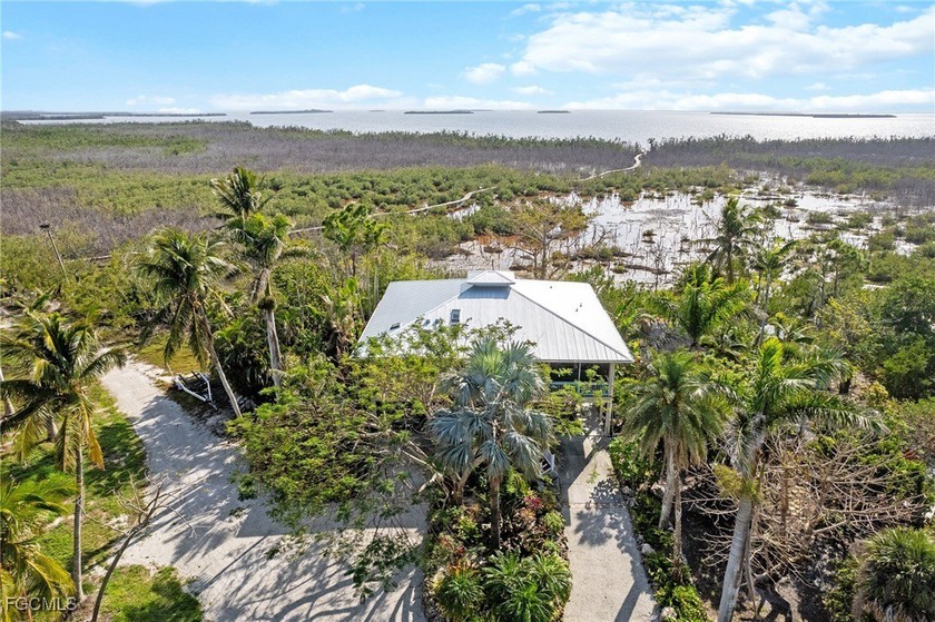 Welcome to your slice of paradise, this one-of-a-kind custom - Beach Home for sale in Bokeelia, Florida on Beachhouse.com
