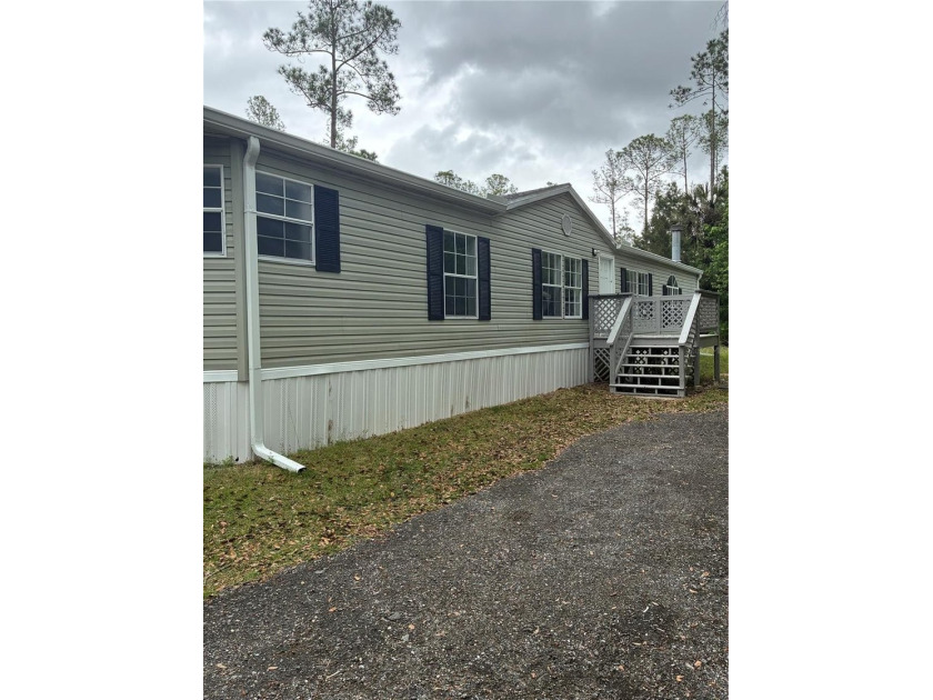 Nestled in the peaceful countryside of Bunnell, this charming - Beach Home for sale in Bunnell, Florida on Beachhouse.com