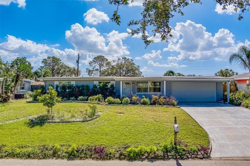 Welcome to this beautiful 4-bedroom, 3-bathroom home with a - Beach Home for sale in Belleair Beach, Florida on Beachhouse.com