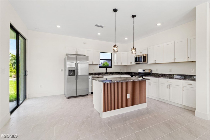 Step into this exquisite brand-new residence where every detail - Beach Home for sale in Lehigh Acres, Florida on Beachhouse.com