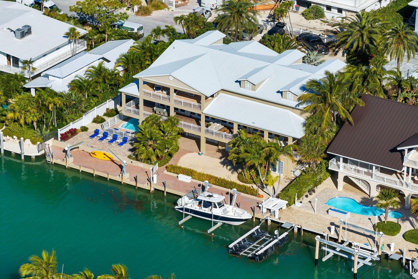 Exquisite Tri-Level Waterfront Estate in Islamorada! Step into - Beach Home for sale in Upper Matecumbe Key, Florida on Beachhouse.com