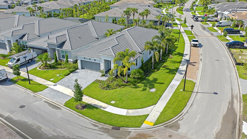 Set on a premium corner lot with lush landscaping and upgraded - Beach Home for sale in Palm Beach Gardens, Florida on Beachhouse.com