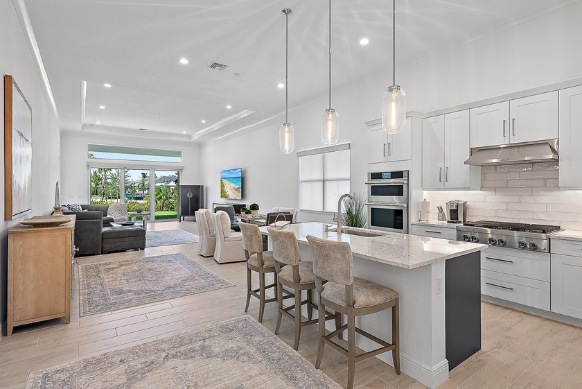 Set on a premium corner lot with lush landscaping and upgraded - Beach Home for sale in Palm Beach Gardens, Florida on Beachhouse.com