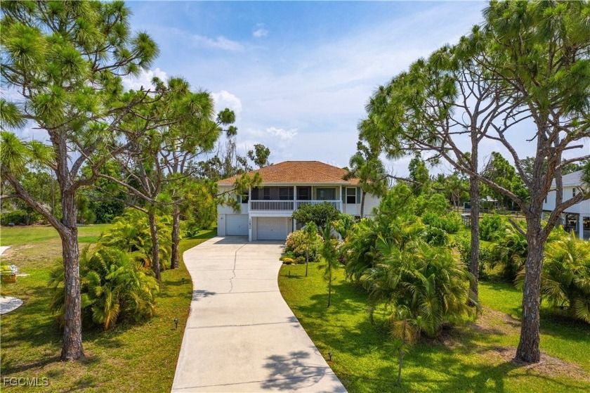 Island Dream Home with Pool, Acreage & Short Commute - Golf Cart - Beach Home for sale in Bokeelia, Florida on Beachhouse.com