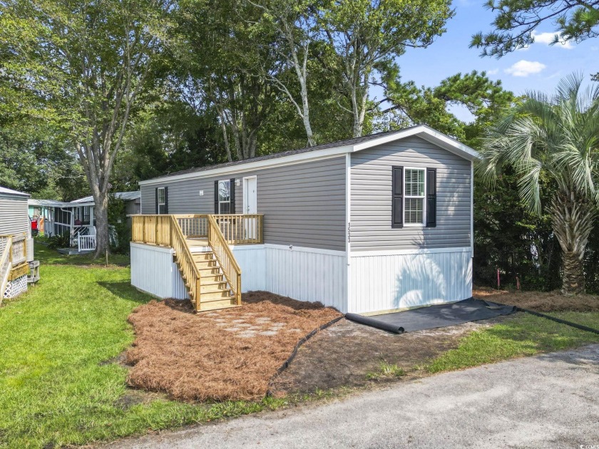 Welcome to your coastal retreat in Garden City Beach! This brand - Beach Home for sale in Garden City Beach, South Carolina on Beachhouse.com