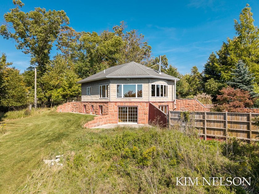 Location meets opportunity in this custom-built 3-bedroom - Beach Home for sale in Whitehall, Michigan on Beachhouse.com