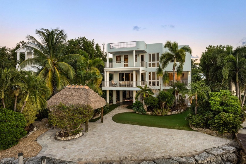 This luxury bayfront home in the Florida Keys offers - Beach Home for sale in Plantation Key, Florida on Beachhouse.com
