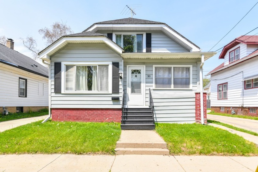 Many updates to this bungalow located across the street from a - Beach Home for sale in Racine, Wisconsin on Beachhouse.com