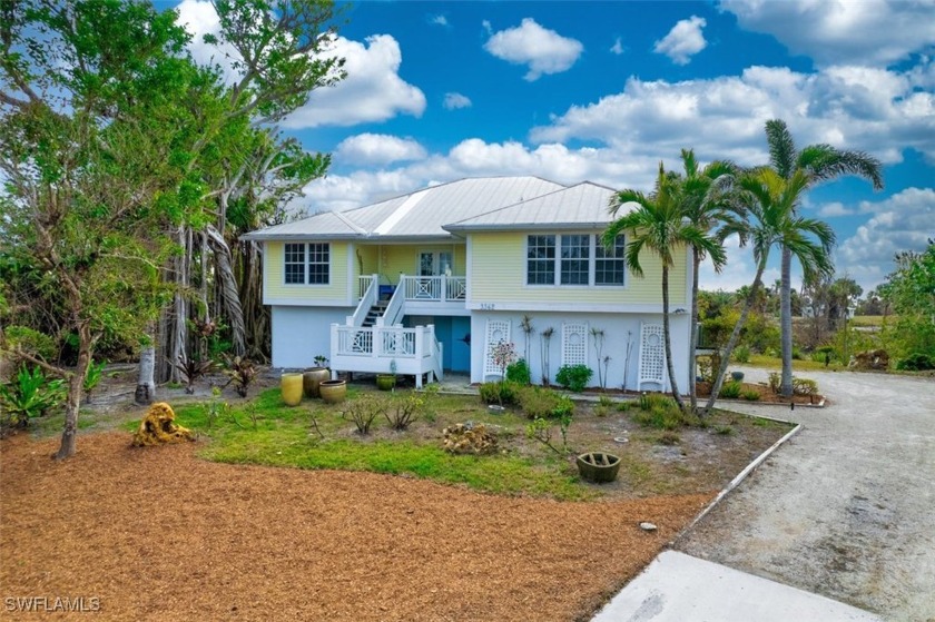Near beach elevated home overlooking a private lake which the - Beach Home for sale in Sanibel, Florida on Beachhouse.com