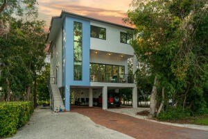 A modern sanctuary tucked among the trees, this residence stands - Beach Home for sale in Key Largo, Florida on Beachhouse.com