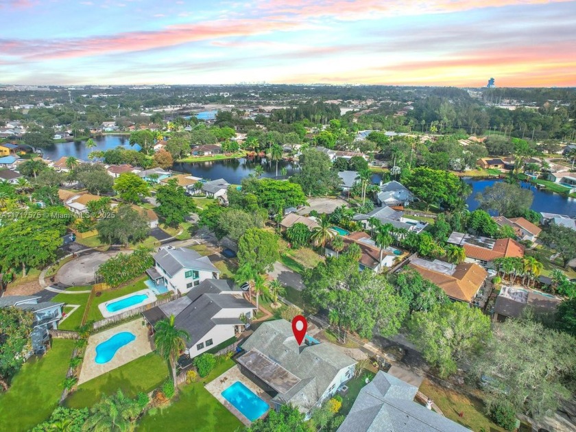 ABSOLUTELY INCREDIBLE 4-BED, 2-BATH POOL, WATERFRONT HOME IN - Beach Home for sale in Cooper City, Florida on Beachhouse.com