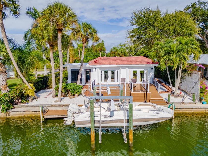 Allow the sunshine, saltwater, and manicured landscape to pull - Beach Home for sale in Nokomis, Florida on Beachhouse.com
