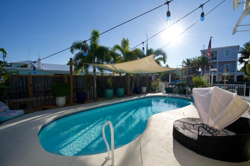 Experience pure paradise in this luxurious 2-bed, 2-bath + den - Beach Home for sale in Marathon, Florida on Beachhouse.com