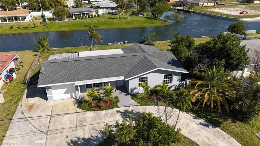 TURNKEY WATERFRONT 3/2 single car garage HOME WITH INTERSECTING - Beach Home for sale in Cape Coral, Florida on Beachhouse.com