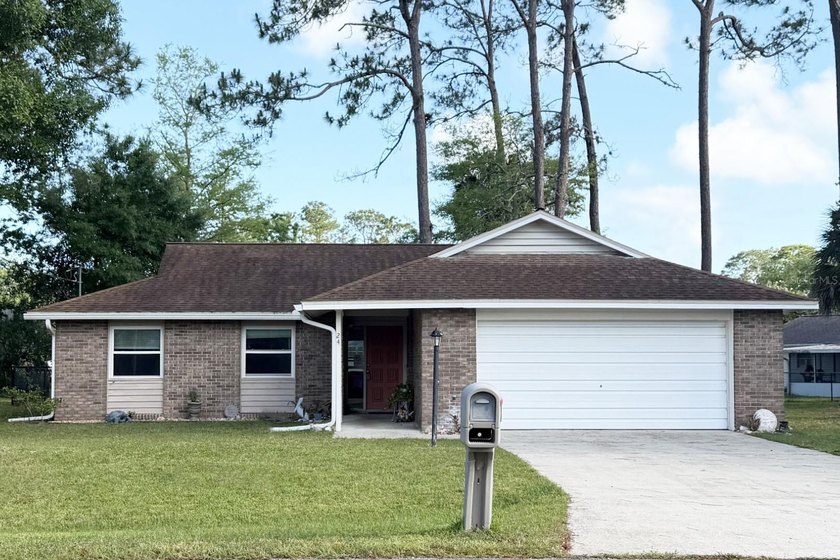 Move-in ready and inviting 3-bedroom, 2-bath home offering 1,238 - Beach Home for sale in Palm Coast, Florida on Beachhouse.com