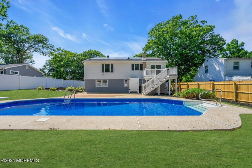 This 3-bedroom 2.5 bath bi-level home certainly stands out with - Beach Home for sale in Manahawkin, New Jersey on Beachhouse.com