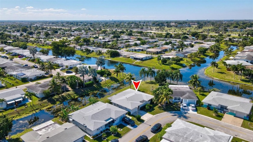 Gorgeous home situated on a corner lot with a lovely water view - Beach Home for sale in Margate, Florida on Beachhouse.com