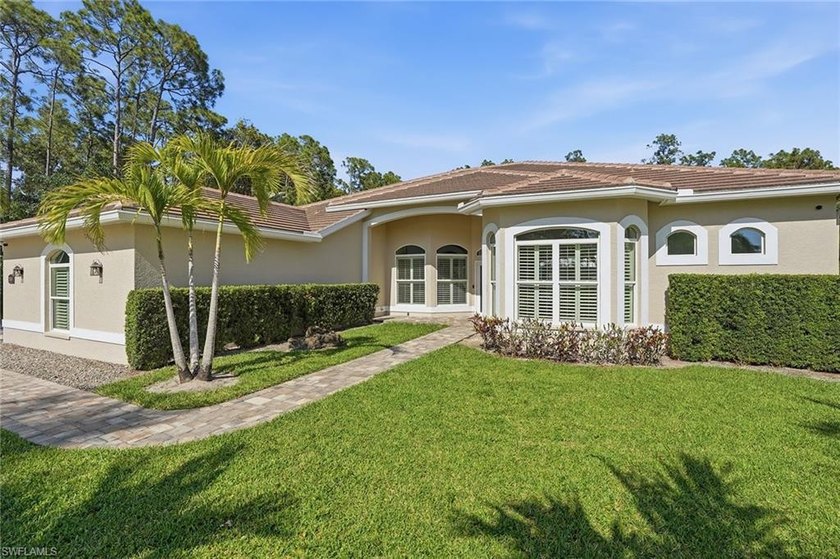 On a rare 1.25-acre private lot with no HOA restrictions, this - Beach Home for sale in Bonita Springs, Florida on Beachhouse.com