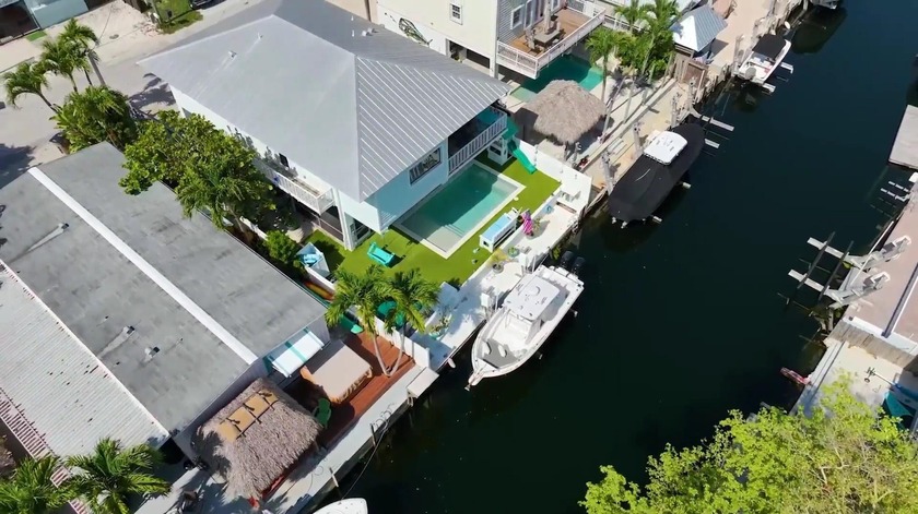 PRICE CUT - NOW $1,399,000 | WATERFRONT HOME WITH POOL IN KEY - Beach Home for sale in Key Largo, Florida on Beachhouse.com