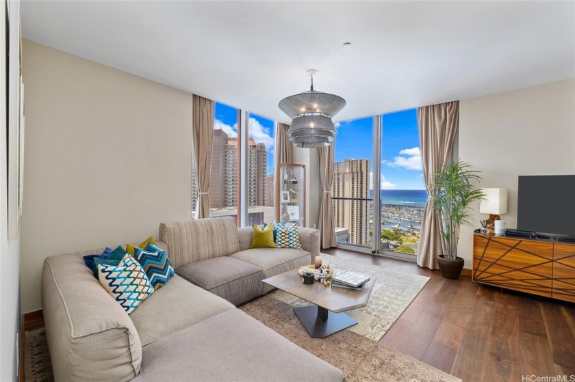 This turnkey 2 bedroom, 2 bath penthouse in the luxurious ONE - Beach Condo for sale in Honolulu, Hawaii on Beachhouse.com