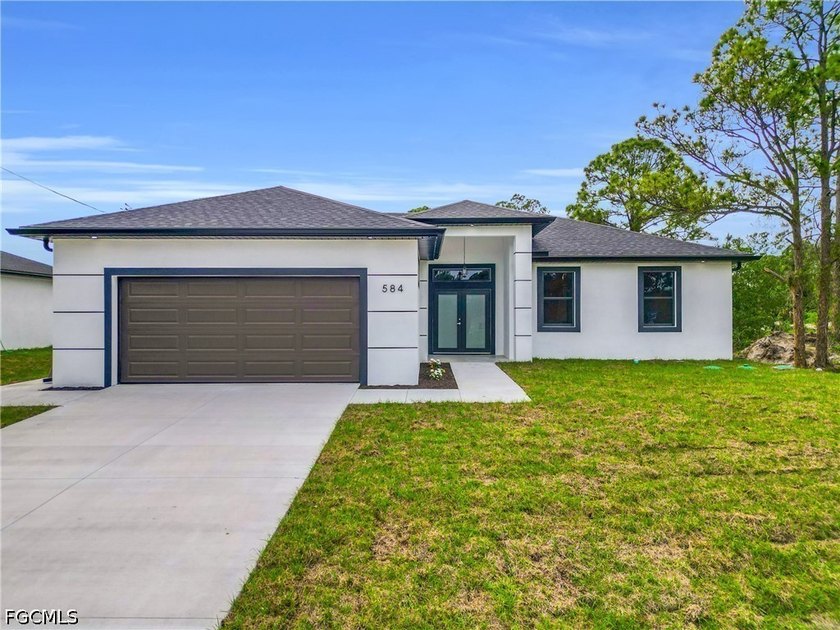 Brand-new construction offering 3 bedrooms plus a versatile den - Beach Home for sale in Lehigh Acres, Florida on Beachhouse.com