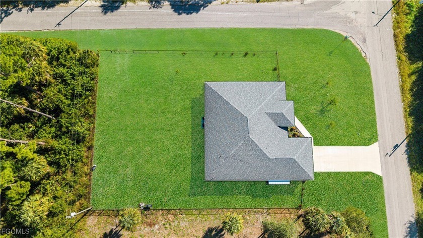 HUGE OVERSIZED CORNER LOT featuring a stunning - Beach Home for sale in Lehigh Acres, Florida on Beachhouse.com