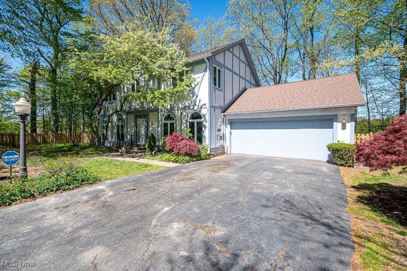 Tucked up on a quiet wooded hill, this updated Tudor offers - Beach Home for sale in Rocky River, Ohio on Beachhouse.com