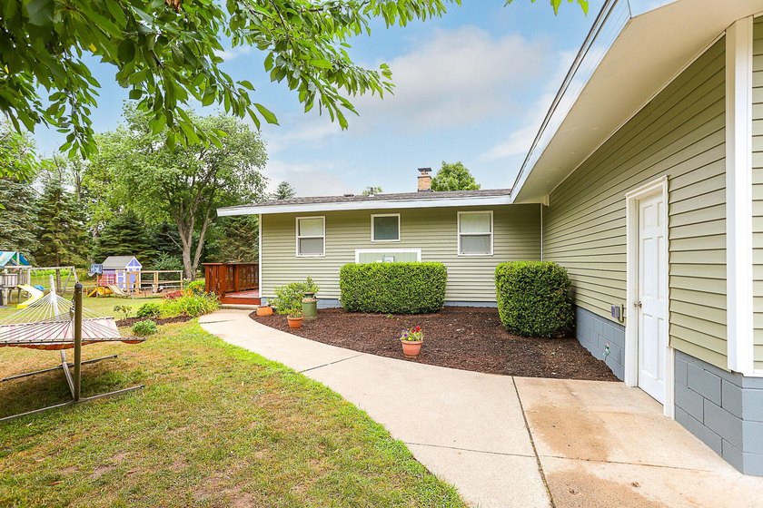 Step into this beautifully updated 4-bedroom, 2-bath home just - Beach Home for sale in South Haven, Michigan on Beachhouse.com