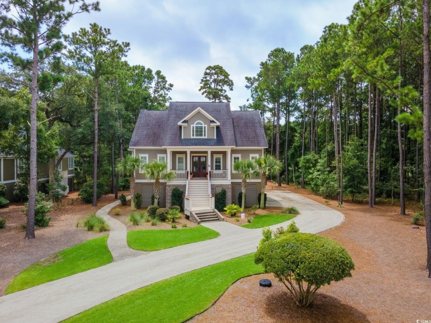 Step into this exquisite 4-bedroom, 3.5-bathroom home nestled on - Beach Home for sale in Georgetown, South Carolina on Beachhouse.com