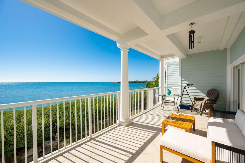 Wake up to panoramic Atlantic Ocean views from this 2 bedroom, 2 - Beach Condo for sale in Stock Island, Florida on Beachhouse.com