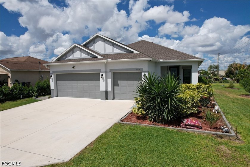 Gorgeous modern home awaits you at 605 Norman St! NOT IN THE - Beach Home for sale in Lehigh Acres, Florida on Beachhouse.com