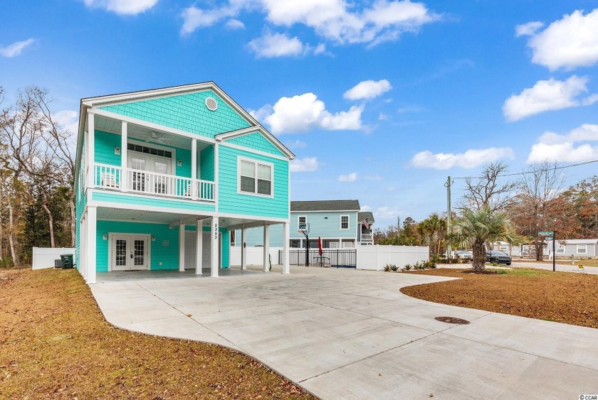 Welcome home to this extraordinary raised beach home in the - Beach Home for sale in North Myrtle Beach, South Carolina on Beachhouse.com
