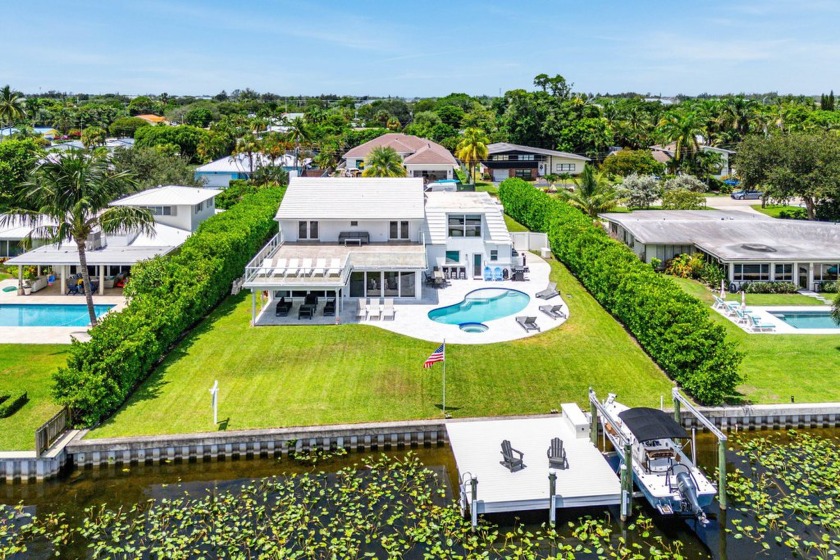 Luxury living on a premier lot in Lake Clarke Shores, this - Beach Home for sale in Lake Clarke Shores, Florida on Beachhouse.com