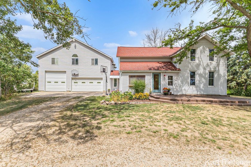 Welcome to this charming classic farmhouse with large attached - Beach Home for sale in Holland, Michigan on Beachhouse.com