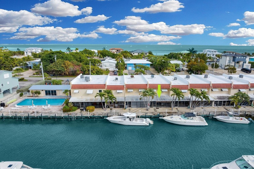 Wake up steps from your assigned dock in this fully turnkey - Beach Condo for sale in Marathon, Florida on Beachhouse.com
