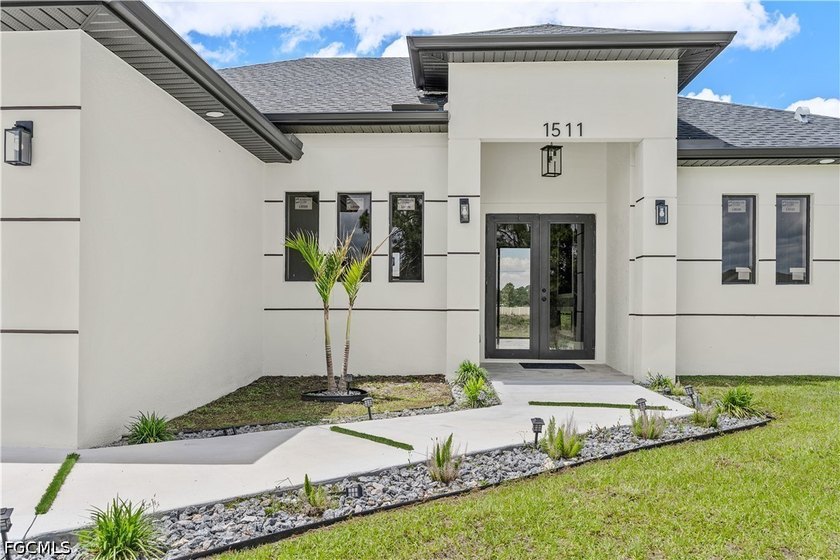 Stunning New Construction on a Cleared Half Acre Lot! This - Beach Home for sale in Lehigh Acres, Florida on Beachhouse.com