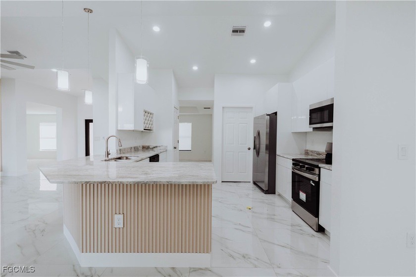 Step into this stunning new construction home offering 4 - Beach Home for sale in Lehigh Acres, Florida on Beachhouse.com