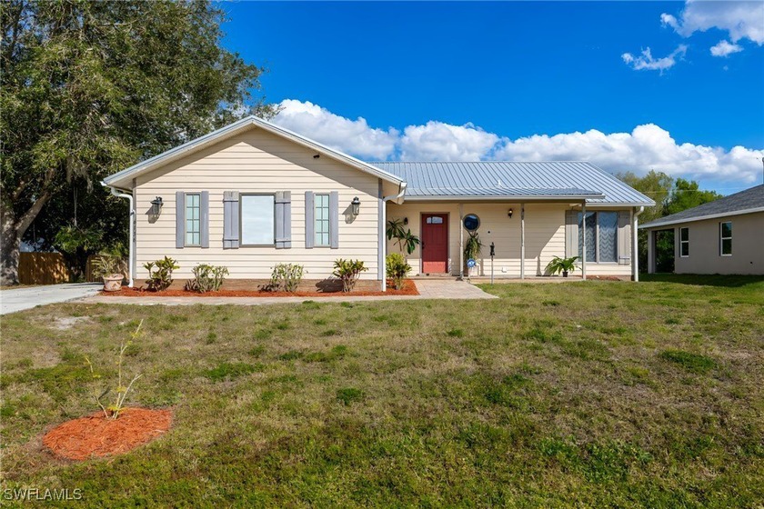 This charming 3-bedroom, 2-bathroom home with an attached 1-car - Beach Home for sale in Fort Myers, Florida on Beachhouse.com