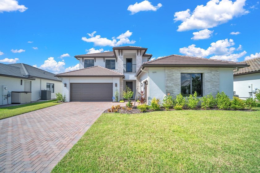This stunning, brand-new home-never before lived in-offers 5 - Beach Home for sale in Ave Maria, Florida on Beachhouse.com