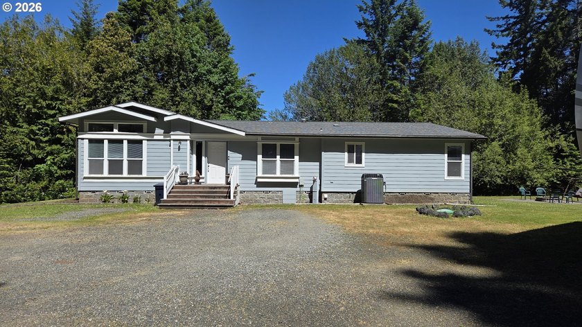 Enjoy a bit of river views from this spacious triple-wide - Beach Home for sale in Gold Beach, Oregon on Beachhouse.com