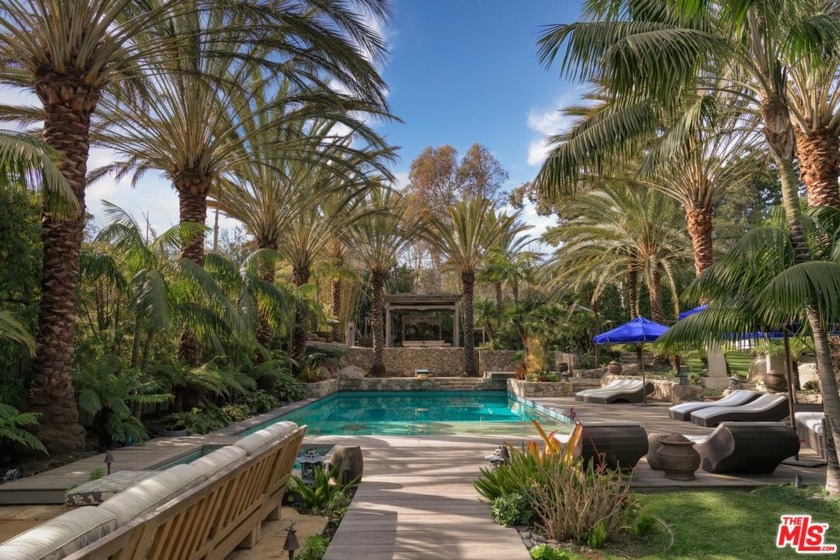 Nestled behind a private gated entrance, this stunning estate - Beach Home for sale in Malibu, California on Beachhouse.com