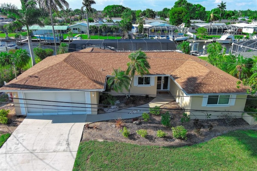 WOW!!!!WAKE UP TO STUNNING WATERFRONT VIEWS OUT YOUR BACKYARD IN - Beach Home for sale in North Fort Myers, Florida on Beachhouse.com