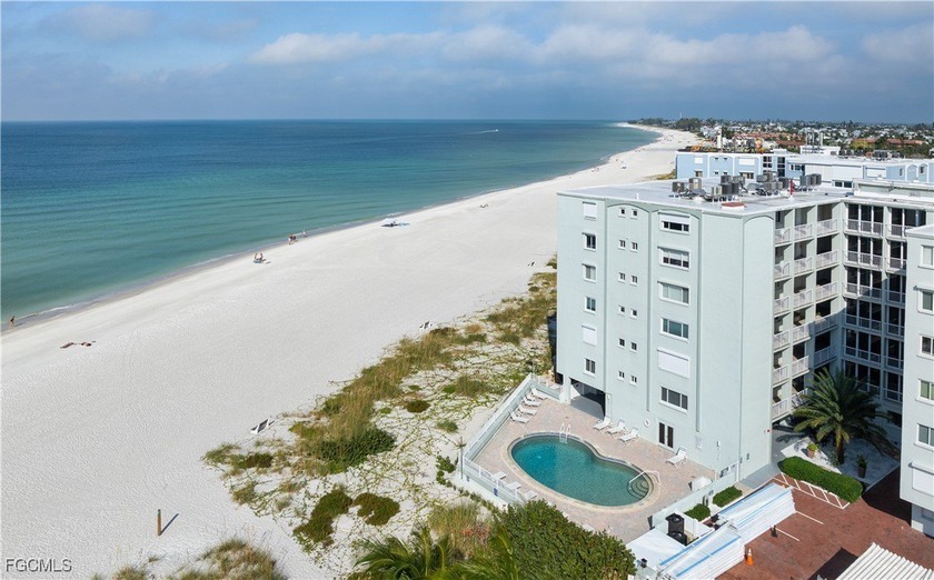 Experience true beachfront living in this stunning corner-unit - Beach Condo for sale in Holmes Beach, Florida on Beachhouse.com