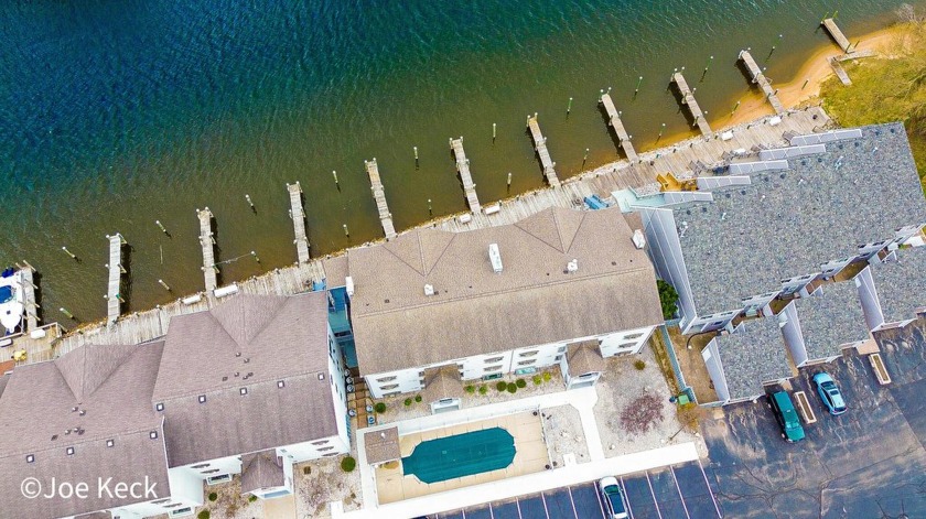 Sunlight pours into this beautifully maintained, fully furnished - Beach Condo for sale in Manistee, Michigan on Beachhouse.com