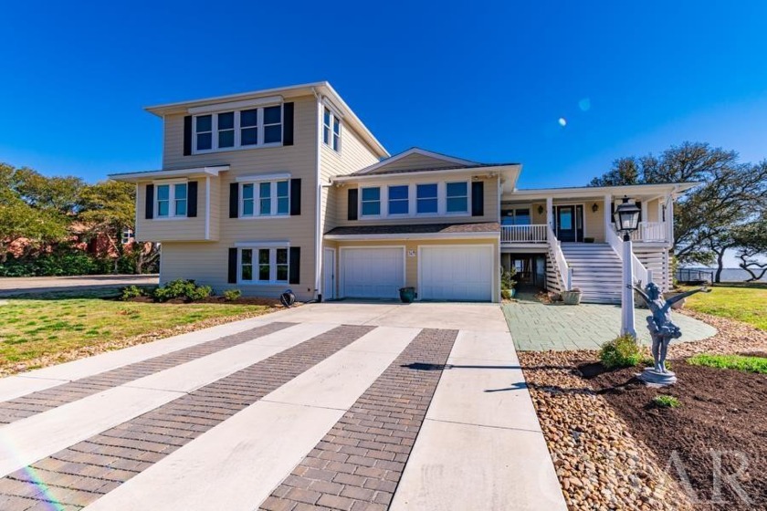 This beautiful soundfront home is located in the highly sought - Beach Home for sale in Manteo, North Carolina on Beachhouse.com
