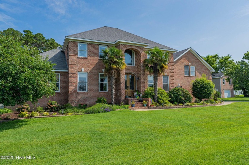 Welcome to this lovely brick home nestled on a spacious  3/4 - Beach Home for sale in Coinjock, North Carolina on Beachhouse.com